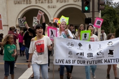Students from Besant Hill, Thatcher and Oak Grove High School shout to passing cars during their "I Matter" march through downtown Ojai, Calif., on Sunday, May, 15, 2011. Holding the sign from left are event organizer, Ana Ming Bostwick-Singer, Charlie Wannagat (on loud speaker) and Tohanh But. The event was held to protest the degradation of the environment and to prevent global warming. The students marched through Ojai as part of a national "I Matter" movement held during the week of May 7-15, 2011. (Photo by Victoria Linssen / Brooks Institute ©2011)